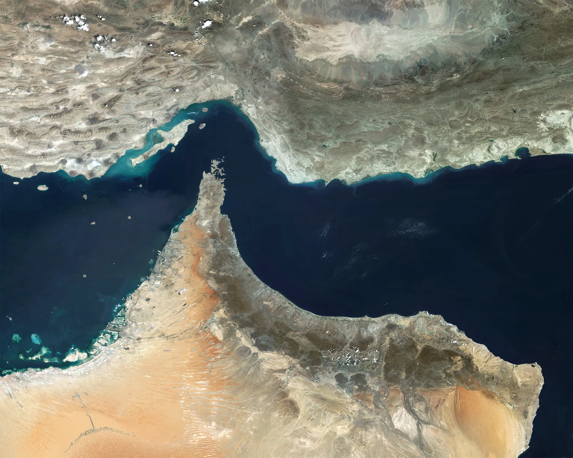Commercial oil tankers navigating in the Strait of Hormuz near the Omani coast.
